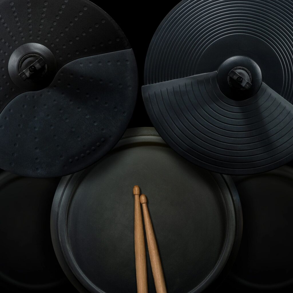 Black Electronic Drum Kit and Wooden Drumsticks